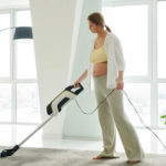 Woman Cleaning Carpet